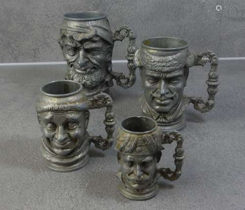 FOUR FIGURAL METAL JUGS WITH CHARACTER HEAD