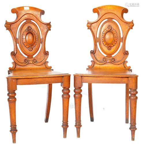 MATCHING PAIR OF VICTORIAN OAK CARVED HALL CHAIRS