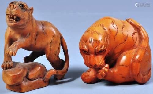 TWO JAPANESE CARVED BOXWOOD TIGER NETSUKES