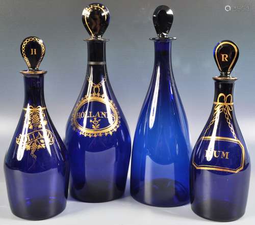 GROUP OF FOUR 19TH CENTURY BRISTOL BLUE DECANTERS