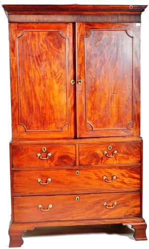 19TH CENTURY GEORGE III FLAME MAHOGANY LINEN PRESS