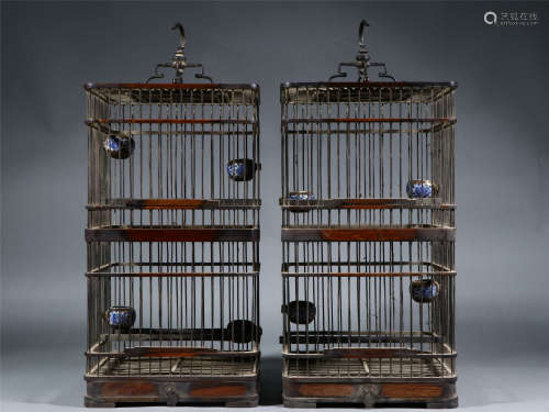 A PAIR OF CHINESE HARDWOOD BIRDCAGES