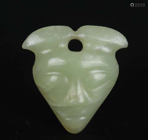 A CELADON JADE ORNAMENT