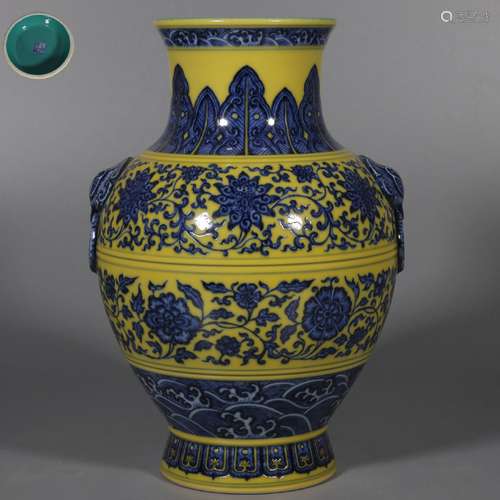 AN UNDERGLAZE BLUE AND YELLOW GROUND INTERLOCKING LOTUS VASE