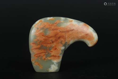 A CARVED WHITE AND RUSSET JADE BLADE GE