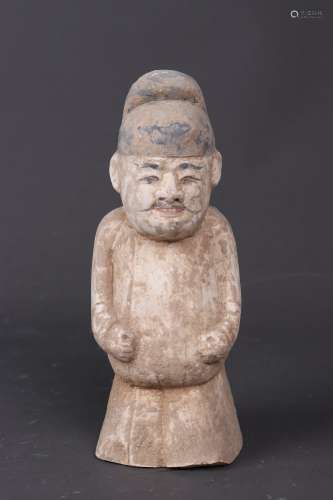 A POTTERY STANDING FIGURE