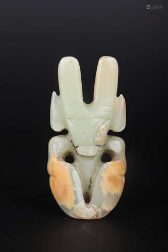 A CARVED WHITE AND RUSSET JADE FIGURE OF BEAST