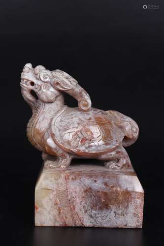 A CARVED BROWNISH JADE MYTHICAL BEAST SEAL