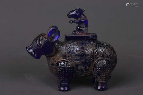 A GLASS ORNAMENT OF BULL AND FIGURE