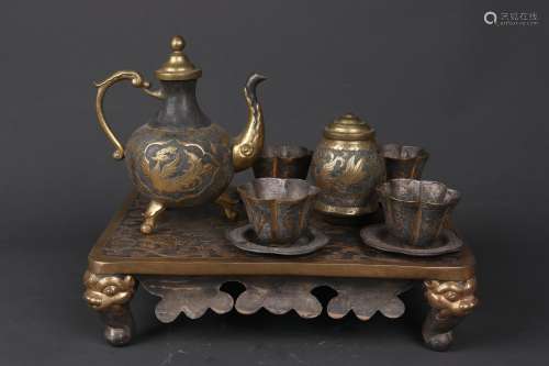 A SET OF GILT BRONZE TEAPOT AND CUPS