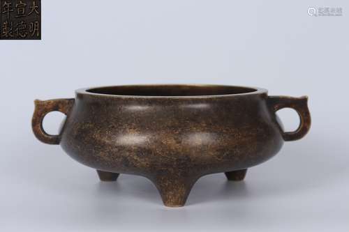 A BRONZE TRIPOD DOUBLE-EARED CENSER