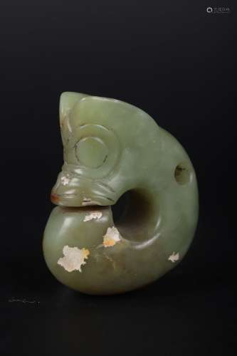 A CARVED CELADON JADE DRAGON ORNAMENT