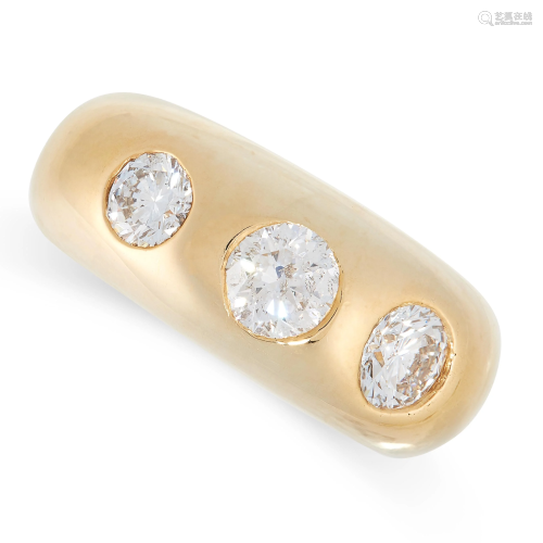 A DIAMOND GYPSY RING in yellow gold, the band set with