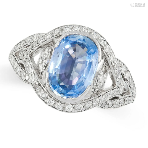 A SAPPHIRE AND DIAMOND RING set with a cushion cut