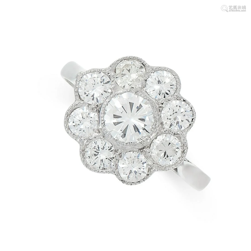 A DIAMOND RING set with a cluster of round cut