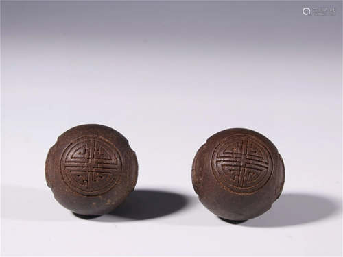 A Pair of Carved Agarwood Beads