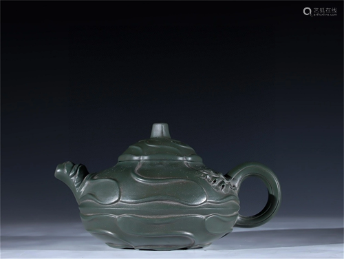 A Carved Yixing Zisha Teapot with Flower Pattern