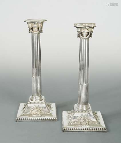 A pair of silver-plated candlesticks,