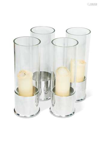 A set of four large 'Shotgun Cartridge' hurricane lamps,