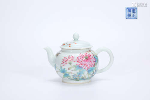 Enamel teapot with colorful butterflies and flowers with poe...