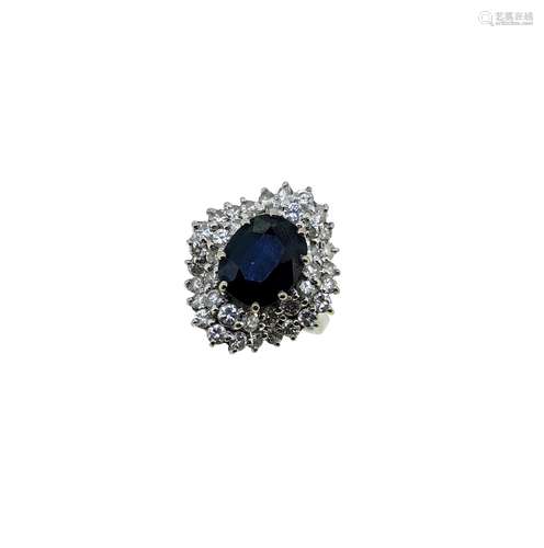 A late 20th century sapphire and diamond cluster ring,