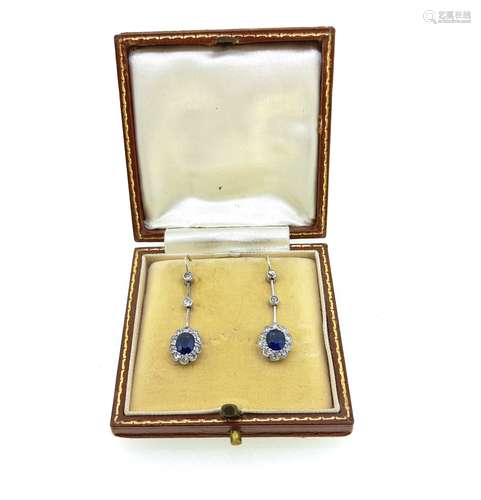 A pair of early 20th century sapphire and diamond cluster ea...