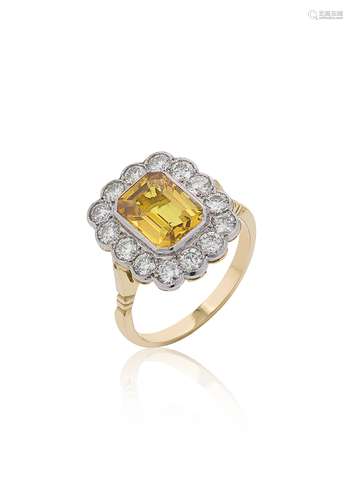 A yellow sapphire and diamond cluster ring,