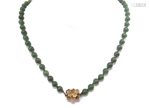 A necklace of nephrite jade beads,