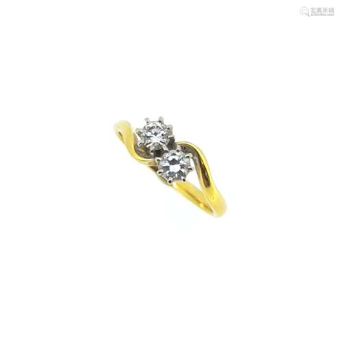 An 18ct gold two stone diamond crossover ring,