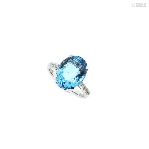 An aquamarine ring with diamond set shoulders,