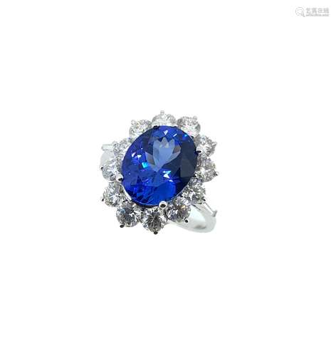 A tanzanite and diamond cluster ring set in 18ct white gold,