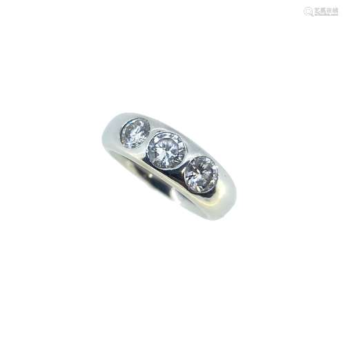 A platinum three stone diamond ring,