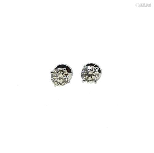 A pair of diamond ear studs,