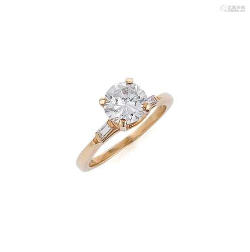 A diamond solitaire ring with diamond set shoulders,