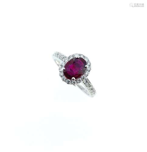 An 18ct gold Burmese ruby and diamond halo style cluster rin...