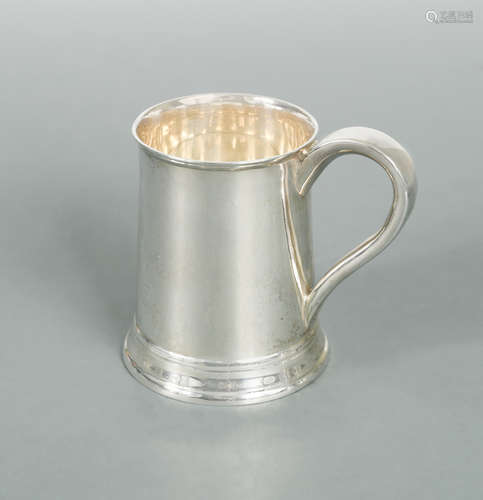 A George V silver mug,