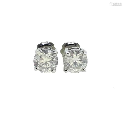 A pair of single stone diamond ear studs,