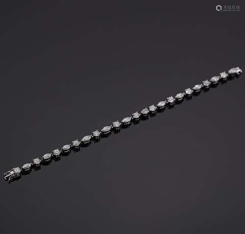 A marquise and round brilliant cut diamond bracelet,