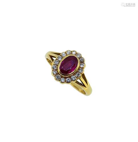 An 18ct gold ruby and diamond cluster ring,