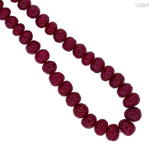 A necklace of carved ruby beads,