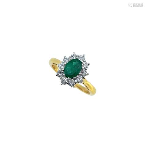 An emerald and diamond cluster ring,