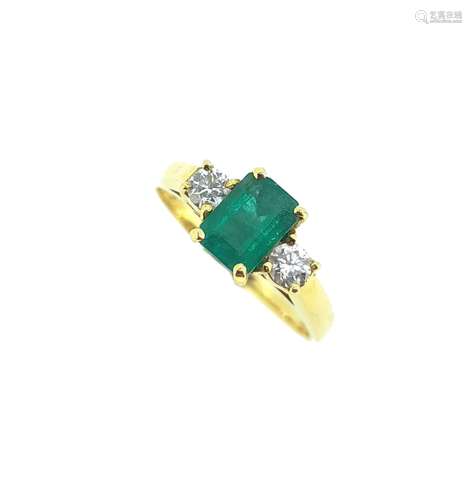 An 18ct gold emerald and diamond three stone ring,