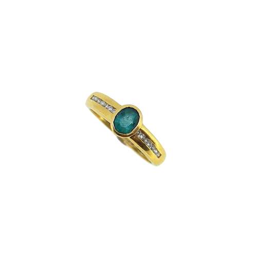 An 18ct gold emerald and diamond ring,