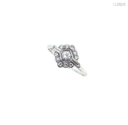 A lozenge shaped diamond cluster ring,