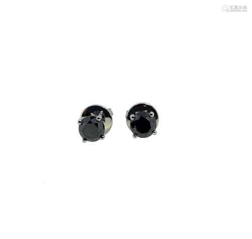 A pair of black diamond ear studs,