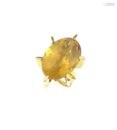 A large oval citrine dress ring,