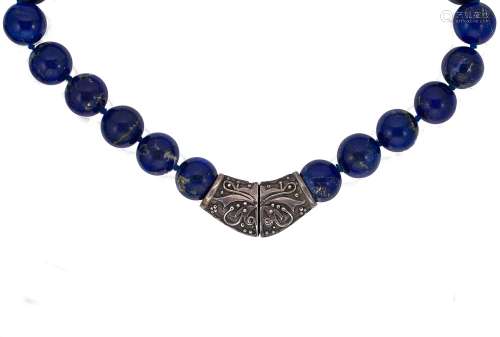 A necklace of lapis lazuli beads,