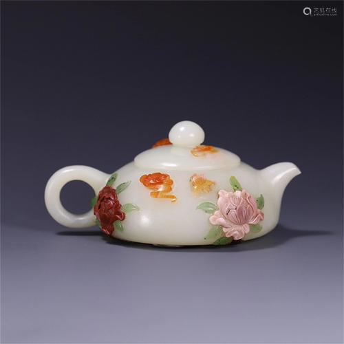 A Carved Jade Teapot with Gems Inlaid