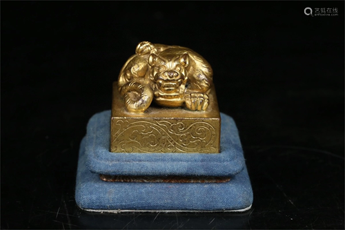 A Gilt Bronze Beast Topped Seal