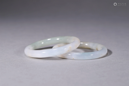A Pair of Chinese Carved Jadeite Bracelets